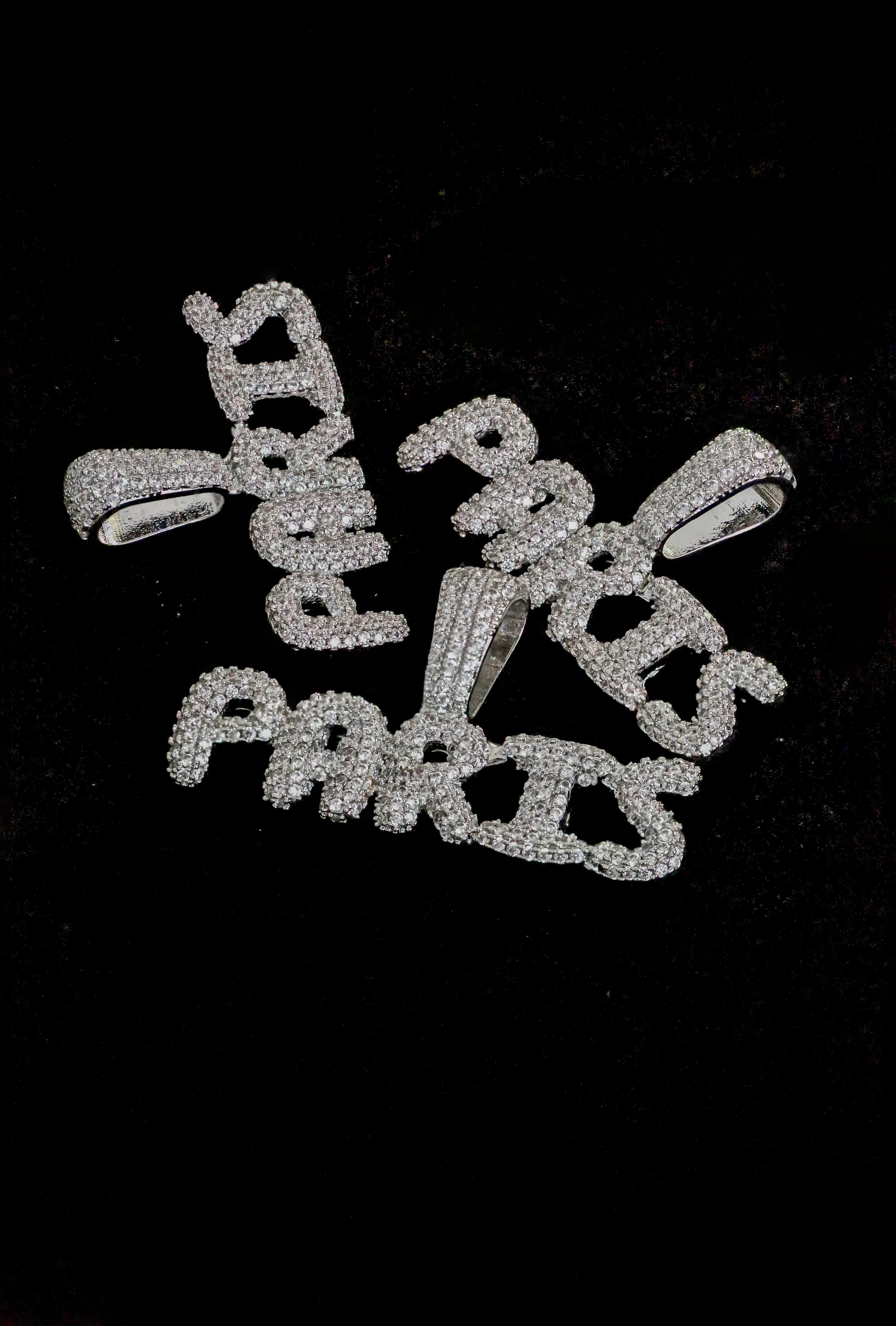 Silver 'Paris' pendant on a black background