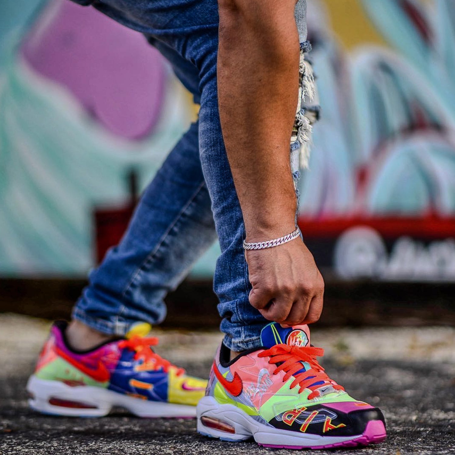 Colorful sneakers with a blurred graffiti background