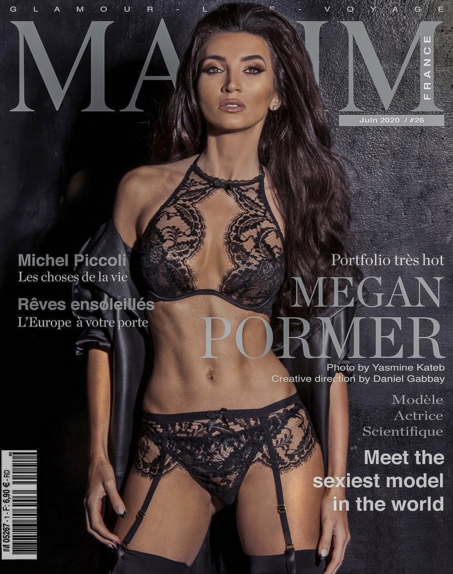 Magazine cover featuring a model in black lingerie with text and branding.